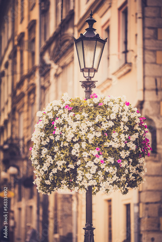 Lamp post in the historical center of the city, summer, vintage photo processing, tourism photo