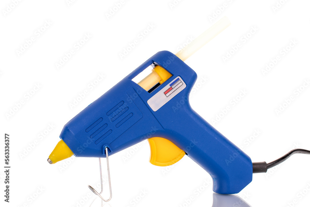 One electric glue gun, macro, isolated on white background. One electric glue gun, macro, isolated on white background.