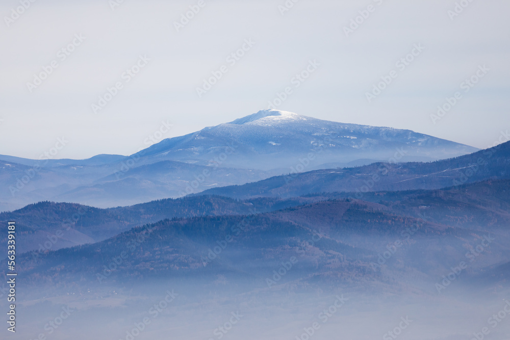 Misty mountains landscape in winter in Poland