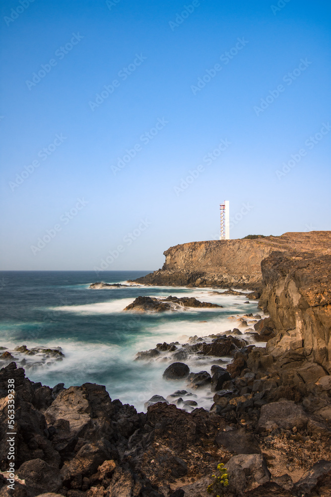 Lighthouse on the cliff overlooking the Atlantic Ocean