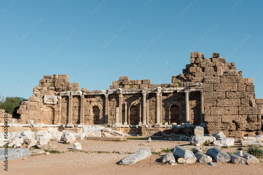 Side Agora (State Agora) - ruins of the ancient city of Side, at summer with clear sky and moon.