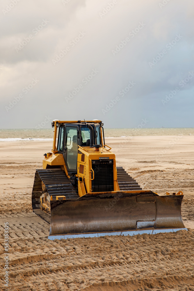 Bulldozer prepares the sea beach for the season. Bulldozer prepares the sea beach for the season.