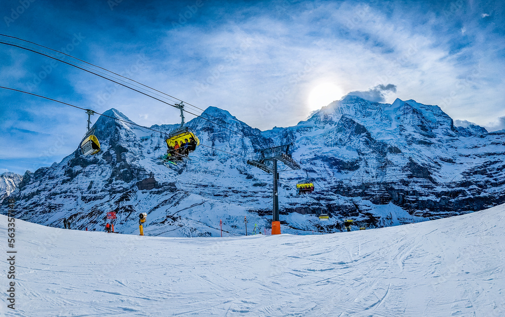 Ski slopes and mountains in Jungfrau ski resort in Swiss Alps, Grindelwald, Switzerland Ski slopes and mountains in Jungfrau ski resort in Swiss Alps, Grindelwald, Switzerland