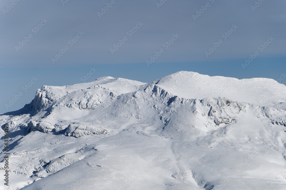 Amazing view of different mountain peaks with snow during winter in Triglav National Park. Beautiful mountain range and amazing attraction for alpine climbers. Adventurous lifestyle. 