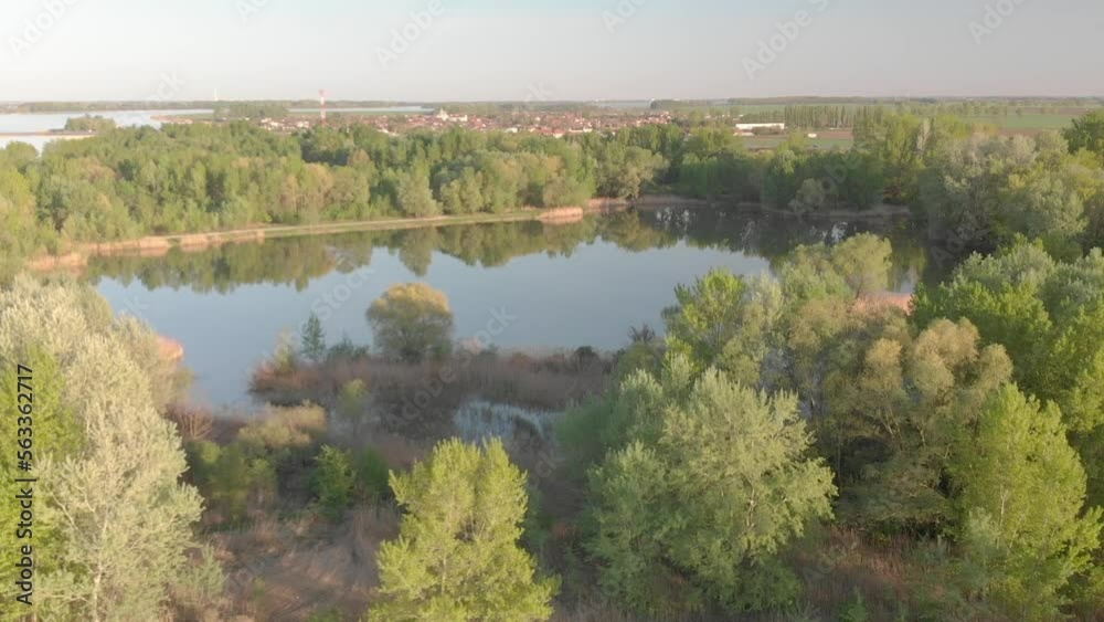 Small islands on a river in the sunset - drone video Small islands on a river in the sunset - drone video