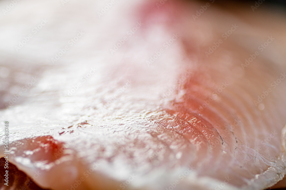 Fototapeta premium Raw fish fillet. Macro background. Texture of fish fillet.