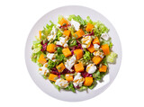 plate of salad with baked pumpkin and cream cheese isolated on transparent background, top view