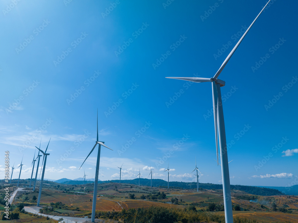 Wind turbine farm power generator in beautiful nature landscape for production of renewable green energy is friendly industry to environment concept of sustainable development technology , earth day	