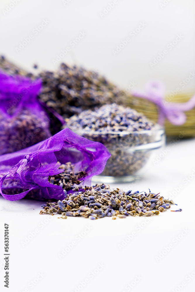 dried lavender flowers in purple gift bags with lavender bouquet on white background dried lavender flowers in purple gift bags with lavender bouquet on white background