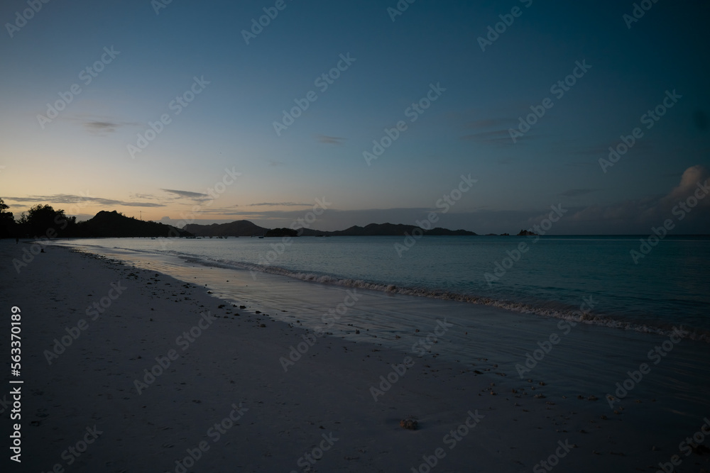 View along the long beach of Anse Volbert in the evening. View along the long beach of Anse Volbert in the evening.