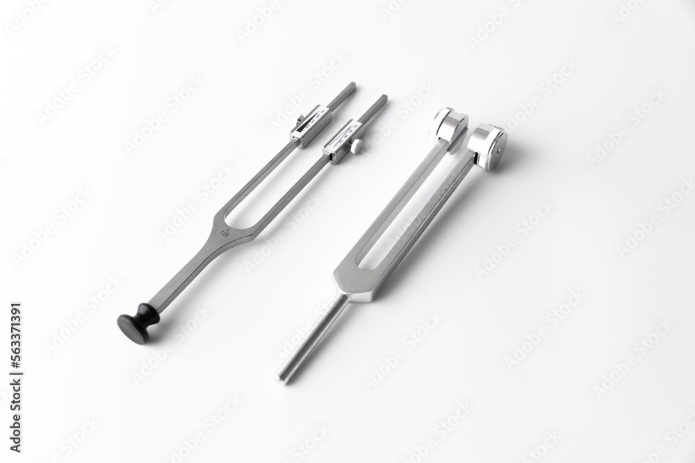 tuning fork C 128 on a white background with gradation tuning fork C 128 on a white background with gradation