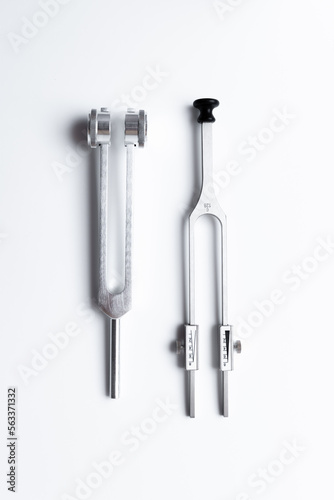 tuning fork C 128 on a white background with gradation, medical instruments, equipment