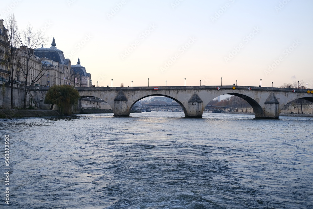 A view of the Seine river during dusk. December 2022, Paris, France.