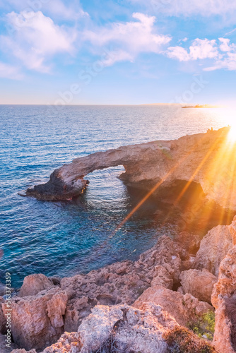 A beautiful evening on a natural stone bridge (Lovers' Bridge) near Ayia Napa in Cyprus. Bridge of love. Cavo Greco