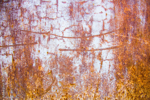 Old cracked paint in craquelure on a rusty metal surfaceGrunge rusted metal texture. Rusty corrosion and oxidized background. Worn metallic iron rusty metal background.