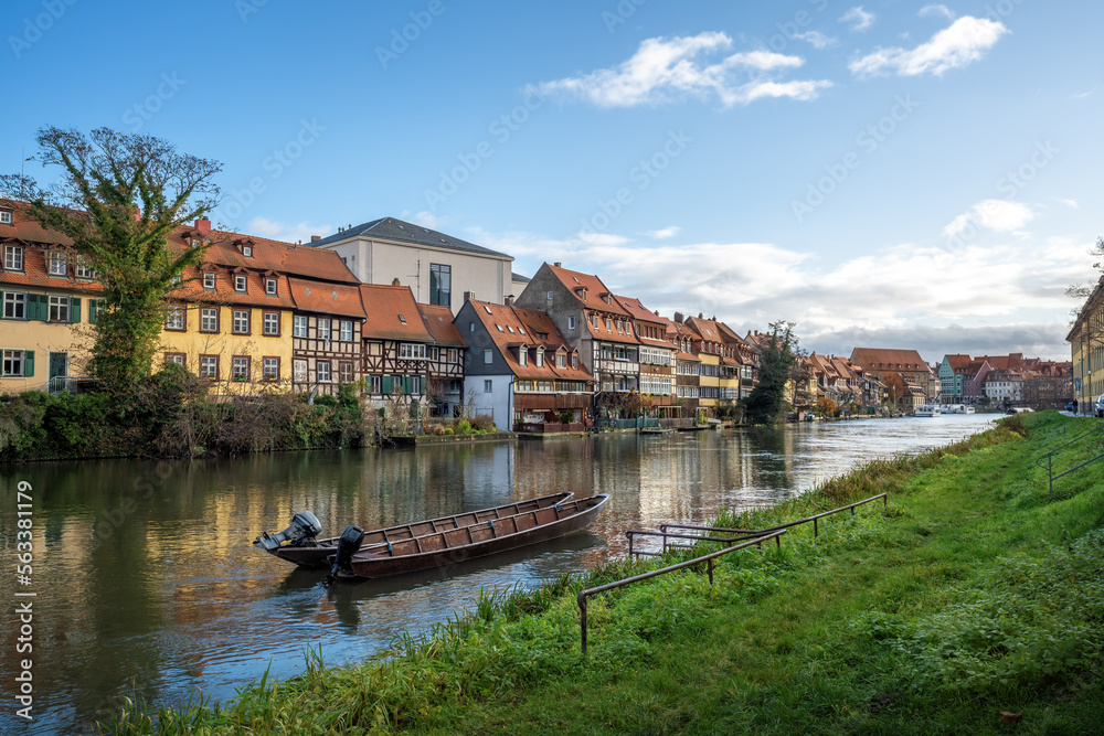 Regnitz River riverbank with small boats and old houses - Bamberg, Bavaria, Germany