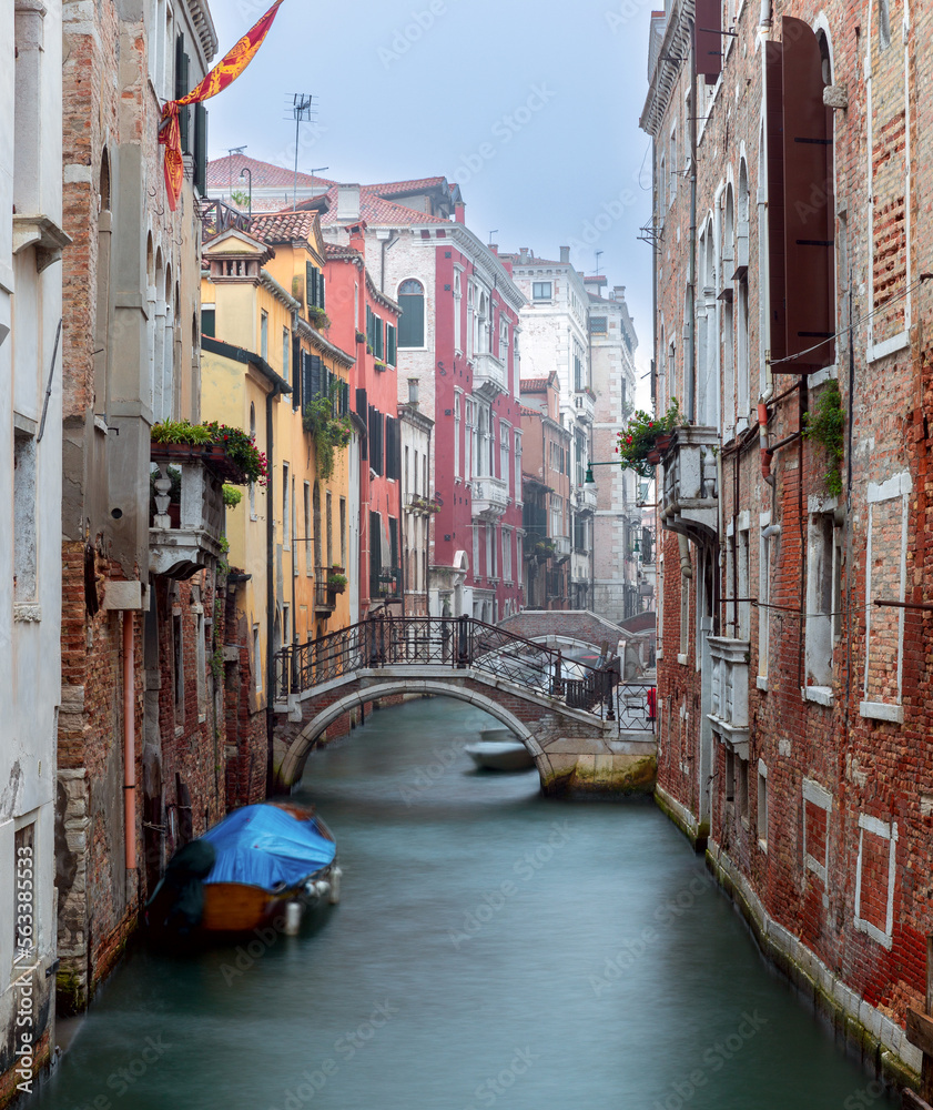Venice. Old colorful houses over the canal in the early morning.