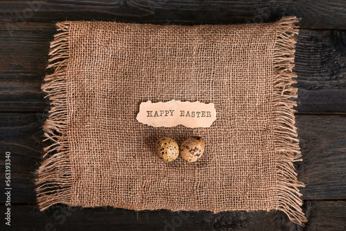 easter eggs on burlap. happy Easter inscription