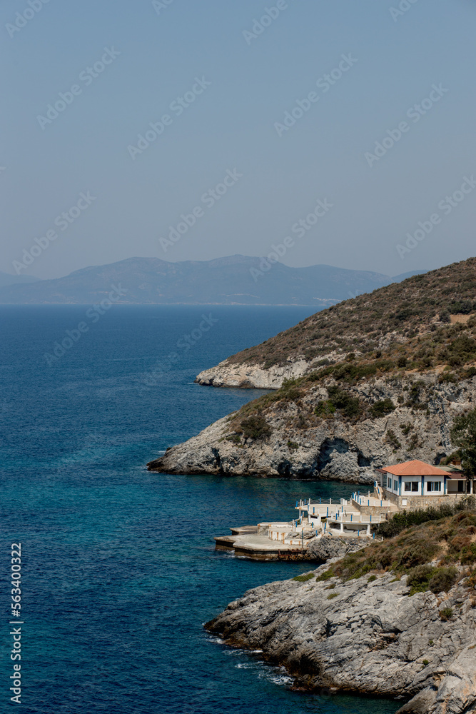 Fototapeta premium View of the Villa on the seashore. Rocky shore with a house.