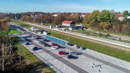 Newly modernized small railway station in Swoszowice district in Krakow, Poland, for fast city trains and regional passengers transportation. Big park and ride P+R incentive parking lot and bus stop photo
