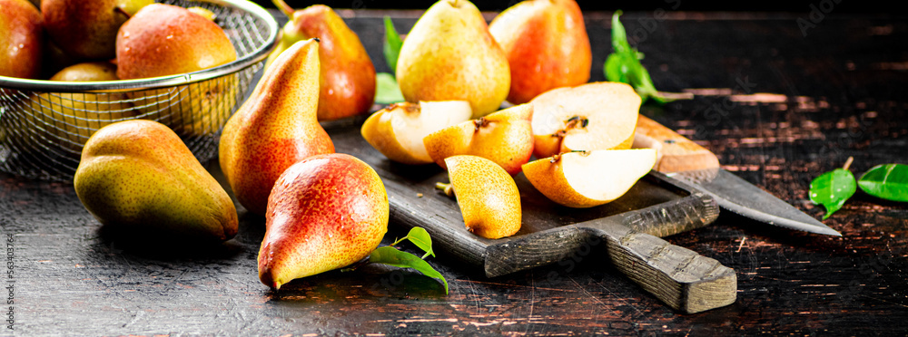 Sliced fresh pear on a cutting board. Sliced fresh pear on a cutting board.
