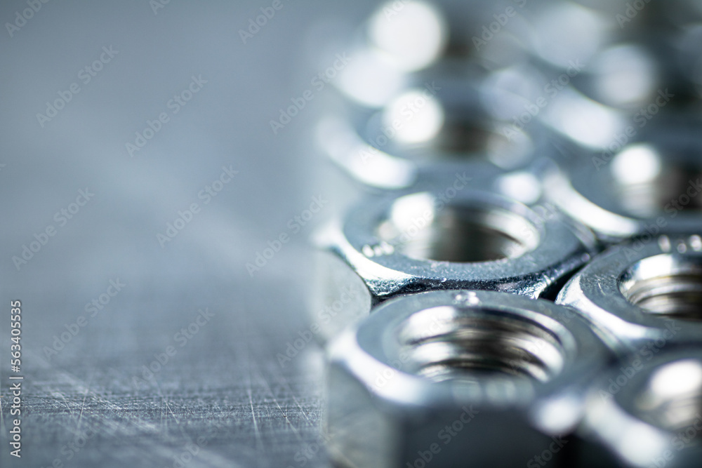 Working tool. Metal nuts on the table. Working tool. Metal nuts on the table.