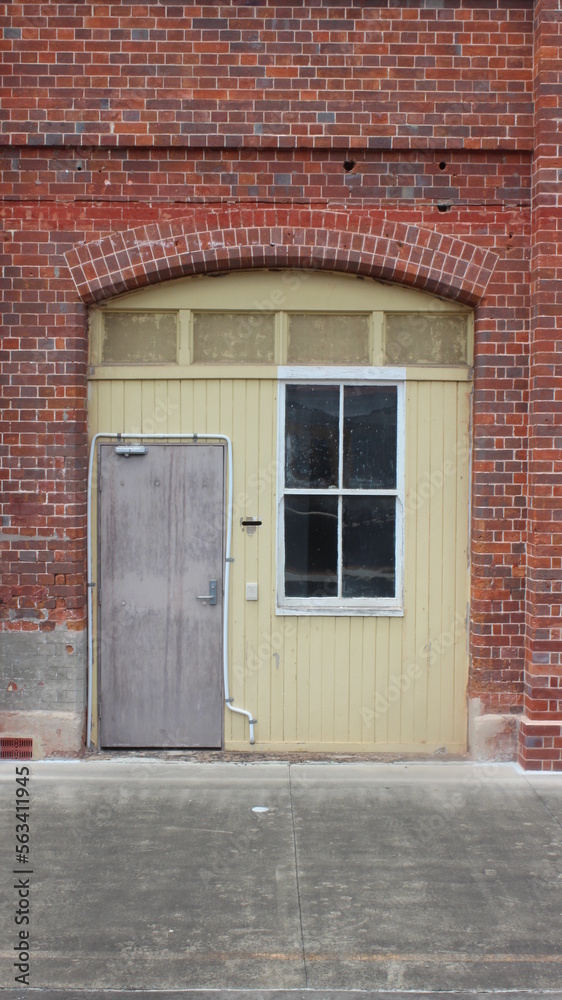 An old wooden door in the heritage brick building at Roma street station, Brisbane, Queensland, Australia. 