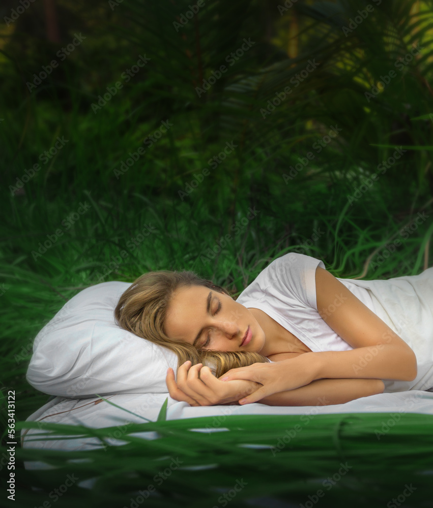 A hidden place. Sleeping woman in deep jungle forest lies on airbed A hidden place. Sleeping woman in deep jungle forest lies on airbed