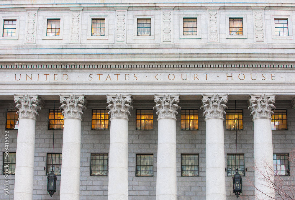 Facade of federal courthouse with towering columns.