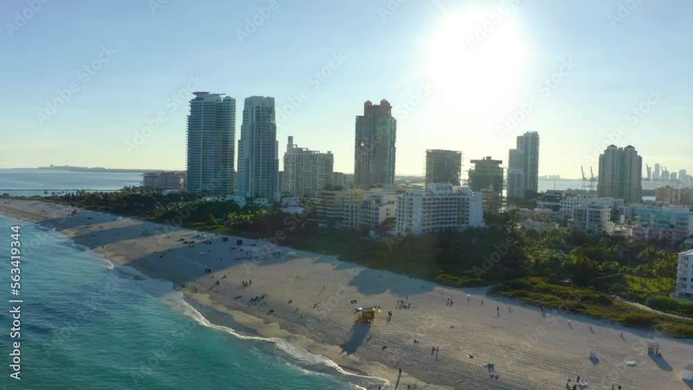 Aerial panoramic view of high rise buildings along sea coast. Modern city borough with hotels and vacation resorts. Miami. Fly over stripe of high rise buildings along sea coast. High rise apartment. Aerial panoramic view of high rise buildings along sea coast. Modern city borough with hotels and vacation resorts. Miami. Fly over stripe of high rise buildings along sea coast. High rise apartment.