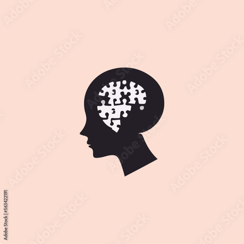 silhouette of a thinking head and a puzzle symbol on the head