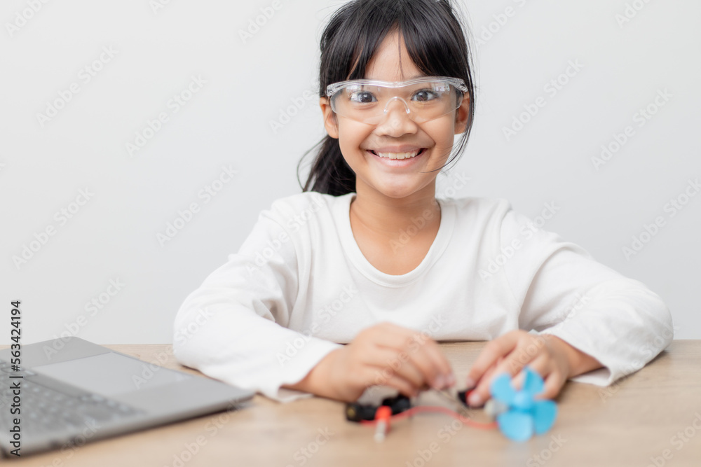 Asia students learn at home in coding robot cars and electronic board cables in STEM, STEAM, mathematics engineering science technology computer code in robotics for kids concept. Asia students learn at home in coding robot cars and electronic board cables in STEM, STEAM, mathematics engineering science technology computer code in robotics for kids concept.