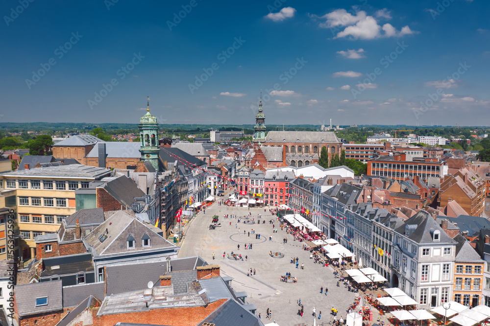 Aerial skyline summer view of vibrant central square (Grand-Place de Mons) and old town hall of Mons (Bergen). Wallonia, capital of Hainaut, Belgium. 