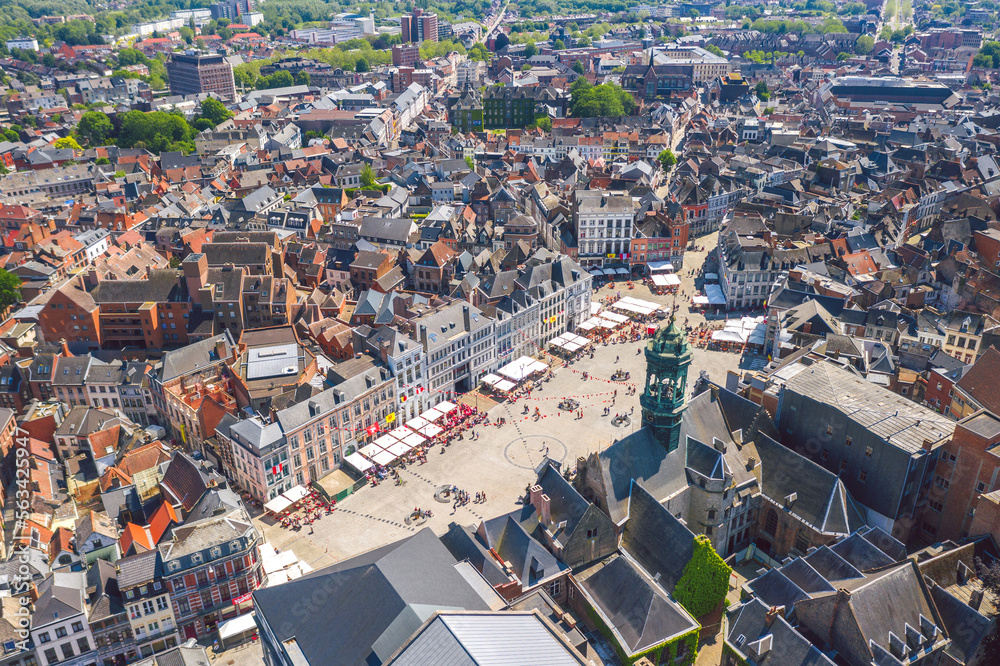Aerial summer view of vibrant central square (Grand-Place de Mons) and old town hall of Mons (Bergen). Wallonia, capital of Hainaut, Belgium.