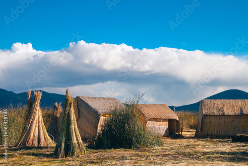 The floating village of Uros on Lake Titicaca, Peru. Lake Titicaca is the largest lake in South America and the highest navigable lake in the world. photo