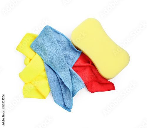 Sponge and car wash cloths on white background, top view