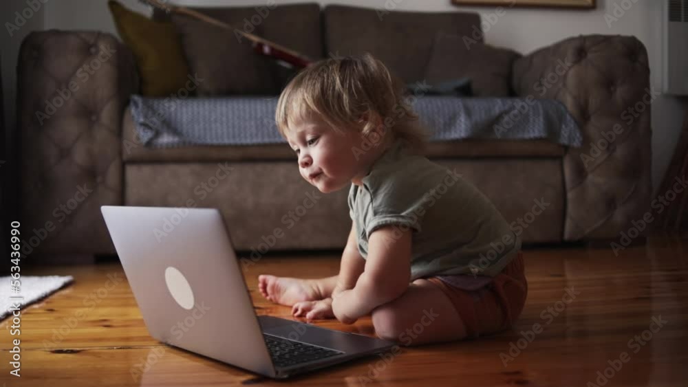 Little baby Kid working on computer in home. Funny video Little baby Kid working on computer in home. Funny video