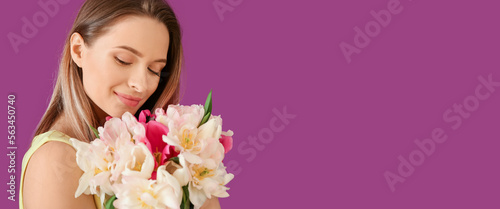 Young woman with bouquet of...