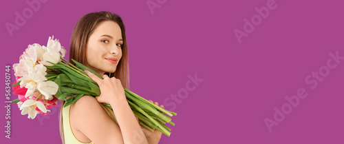 Young woman with bouquet of...