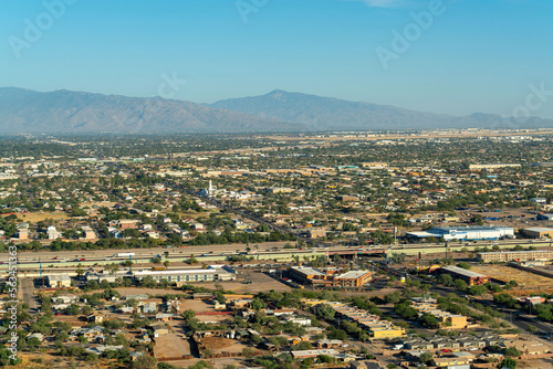 Suburban or uban area of the city in Tuscon Arizona in the Sonora desert in the harsh sunlight and with moutains © Aaron