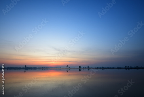 Panoramic view of dawn sky over the lake.