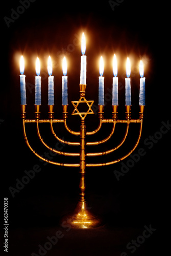 Menorah Lit for the Eighth Night of Hanukkah on a Black Background 