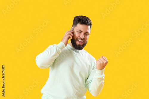 Happy young bearded man tal...