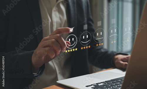 Wallpaper Mural Selective focus at finger of business man while point finger to choose feedback on excellent customer service with five star score with smile. Service evaluation concept with futuristic icon. Torontodigital.ca