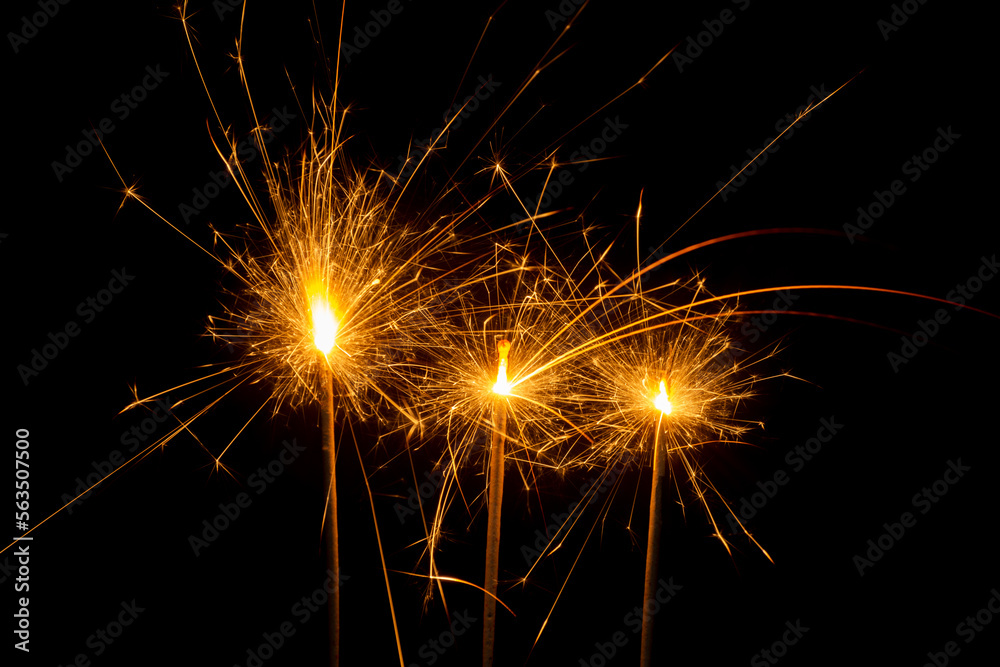 yellow fireworks sparks celebrate the new year Christmas holiday festival party festive night atmosphere on a black background