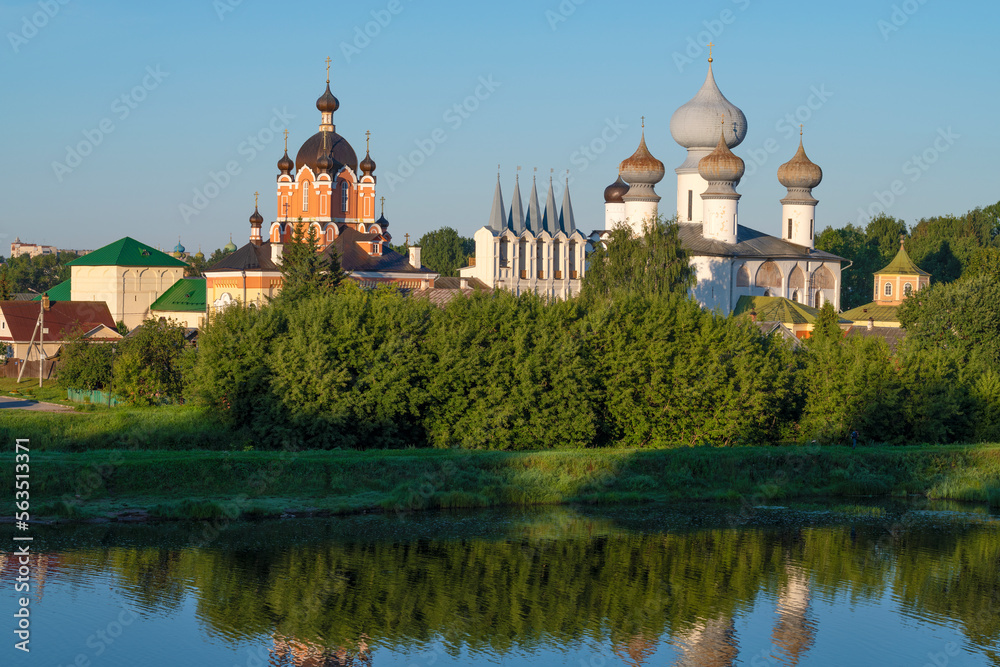 Domes of the ancient Tikhvin Assumption Monastery in the summer landscape on a sunny August morning. Leningrad region, Russia