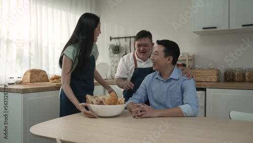 Happy Asian family enjoy cooking in the kitchen at home.