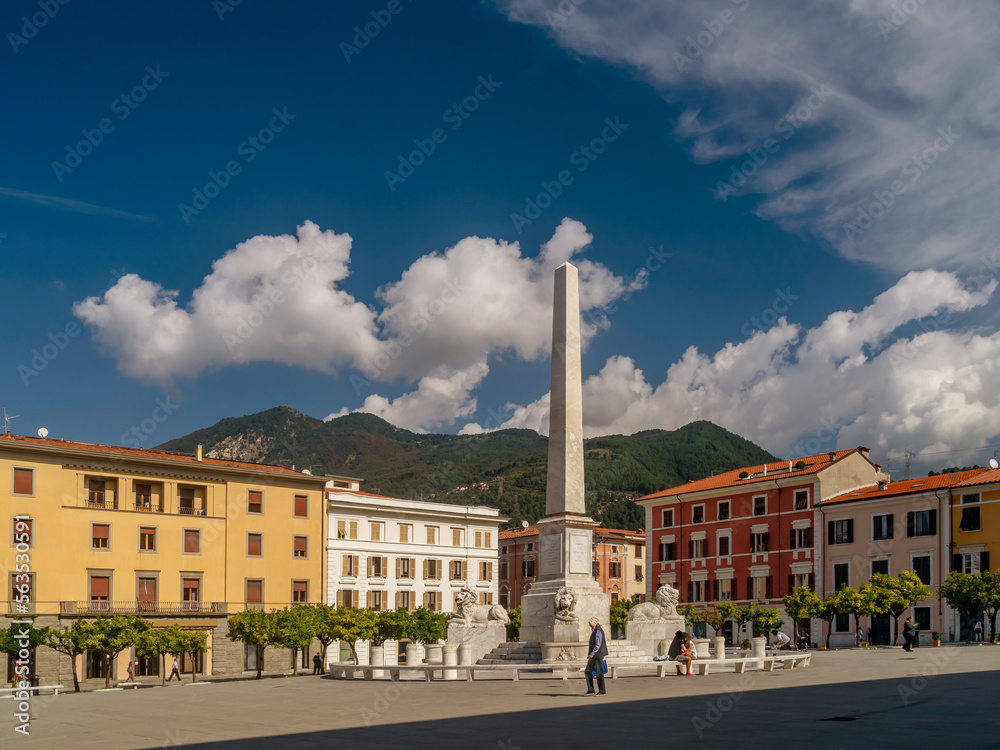 The obelisk in Piazza Aranci square, Massa, Italy, on a sunny day 