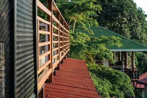 Wooden balcony on the terrace of the hill during sunrise.