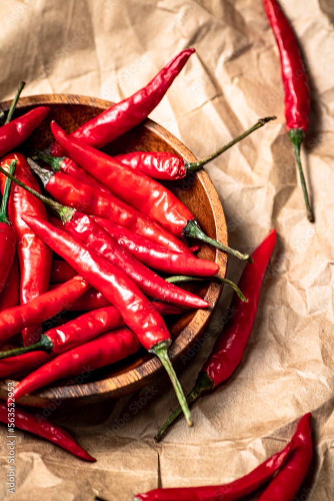 Red chili peppers on a plate of paper. Red chili peppers on a plate of paper.